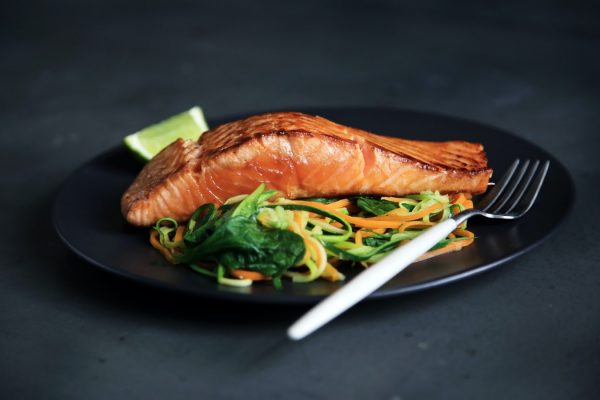 Cooked Salmon on top of spirals of courgette and carrot